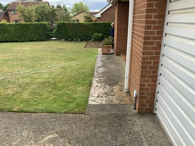Before image of small pathway and grassed area